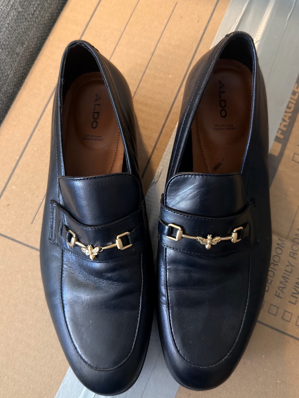 Arrow Black Leather Men's Slip-On Loafers with Gold Bit Detail